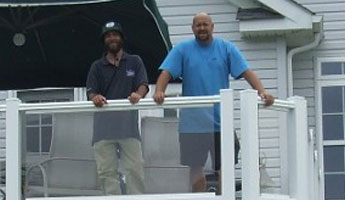 Two People Standing in The Balcony